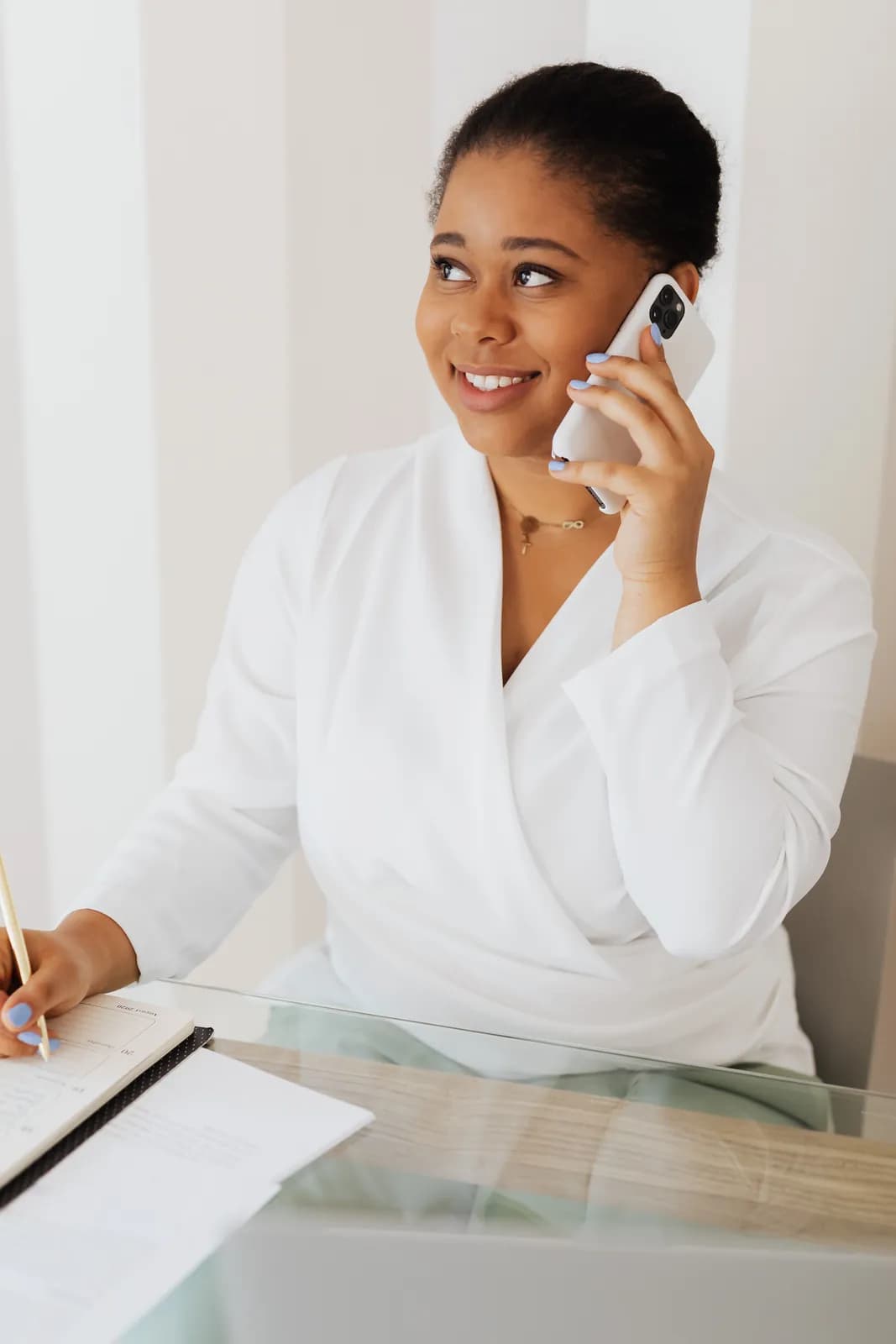 A receptionist at a practice front desk